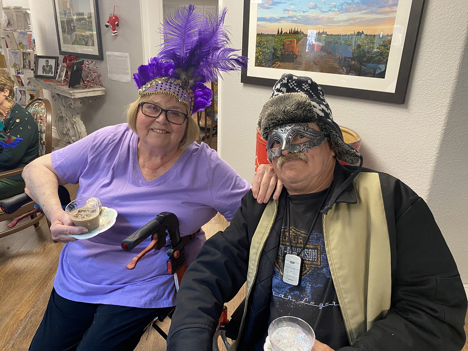 Residents with dessert and Mardi Gras costumes Lodi